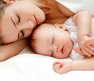 Baby Sleeping with Mom
